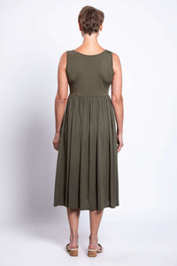Back view of an olive green empire waist midi dress