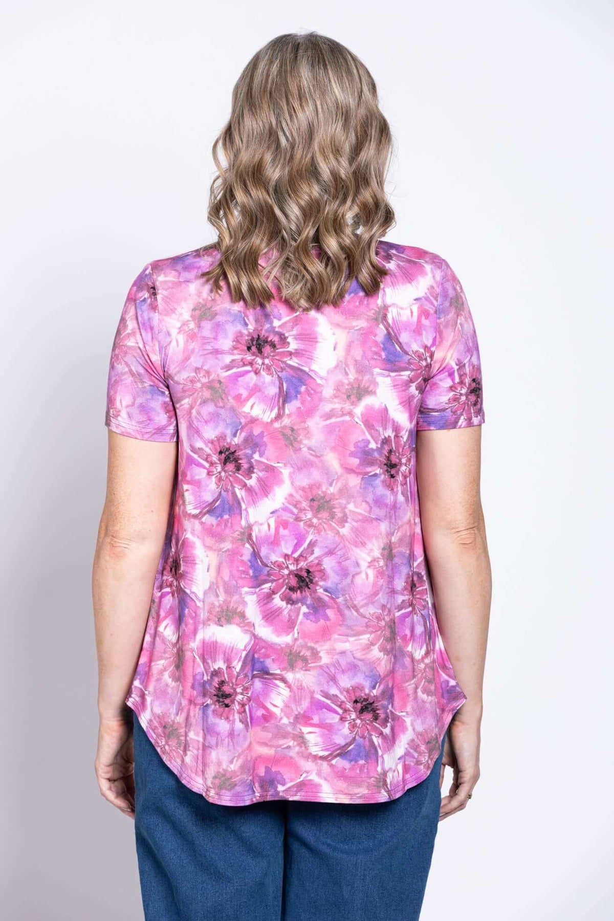 Back view of woman wearing pink and purple floral bamboo top