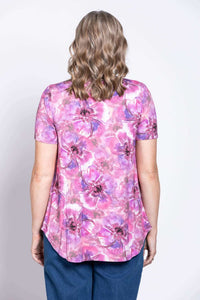 Back view of woman wearing pink and purple floral bamboo top