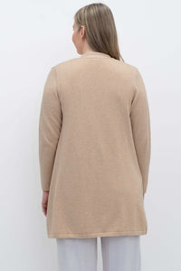Back view of woman wearing beige open cardigan sweater