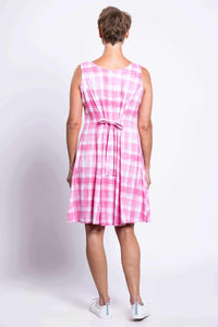 Back view of sleeveless pink plaid dress with tie-belt detail at the waist