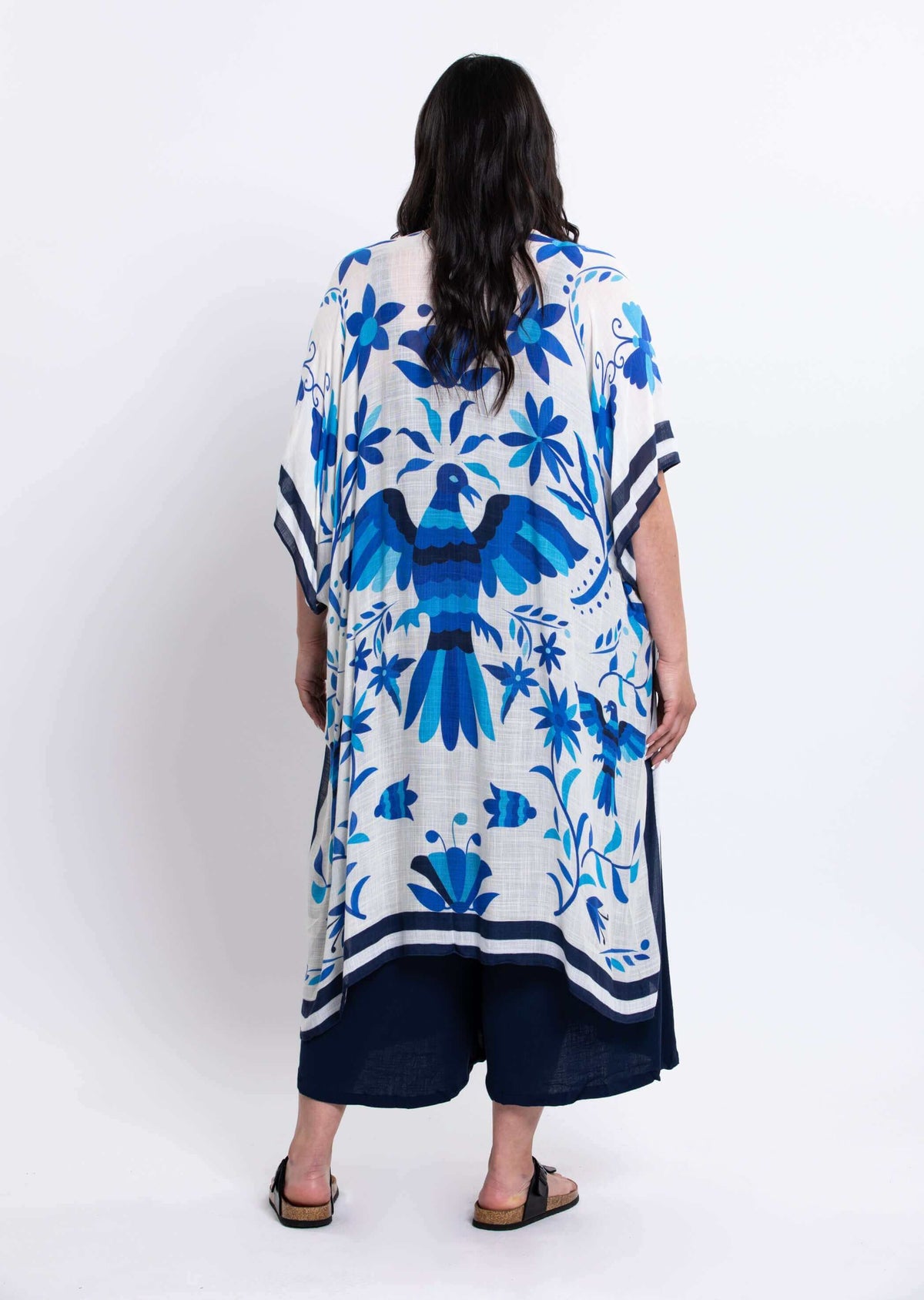 Back view of Darcy Kimono Wrap with bold blue bird and flower motifs
