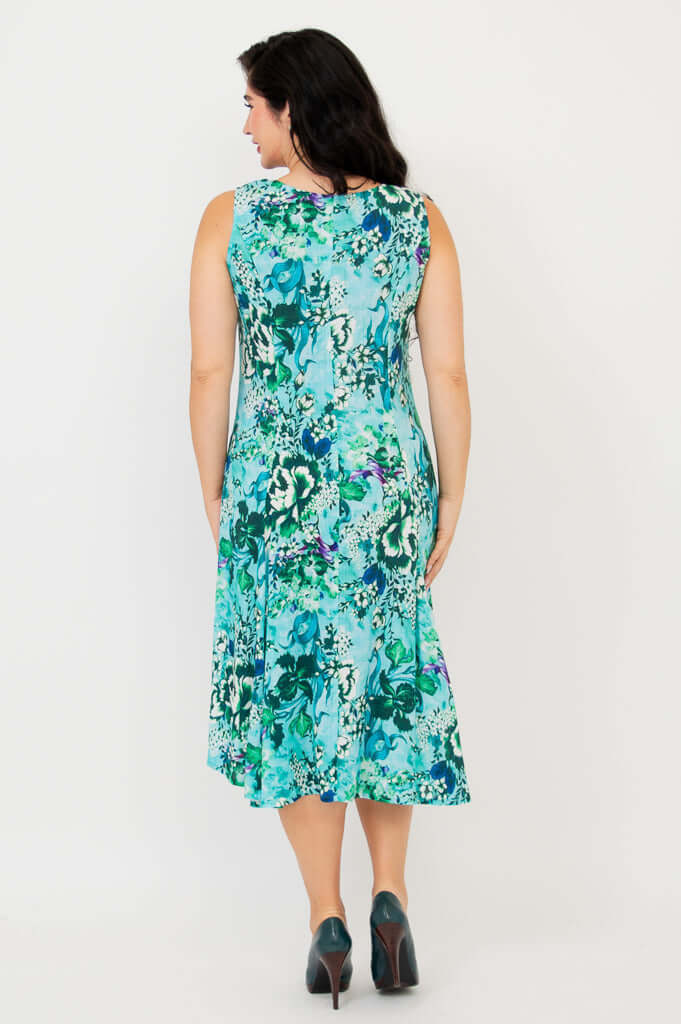 Back view of model showcasing the full length of the aqua floral A-line dress