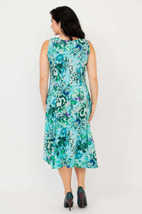 Back view of model showcasing the full length of the aqua floral A-line dress