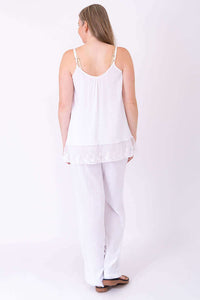 Back view of woman wearing white Chantilly Lace Tank and pants