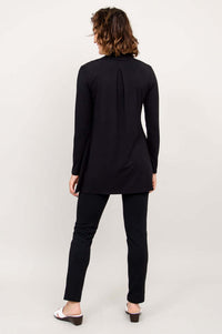 Back view of Chopra jacket showing box pleat and soft drape in black bamboo fabric