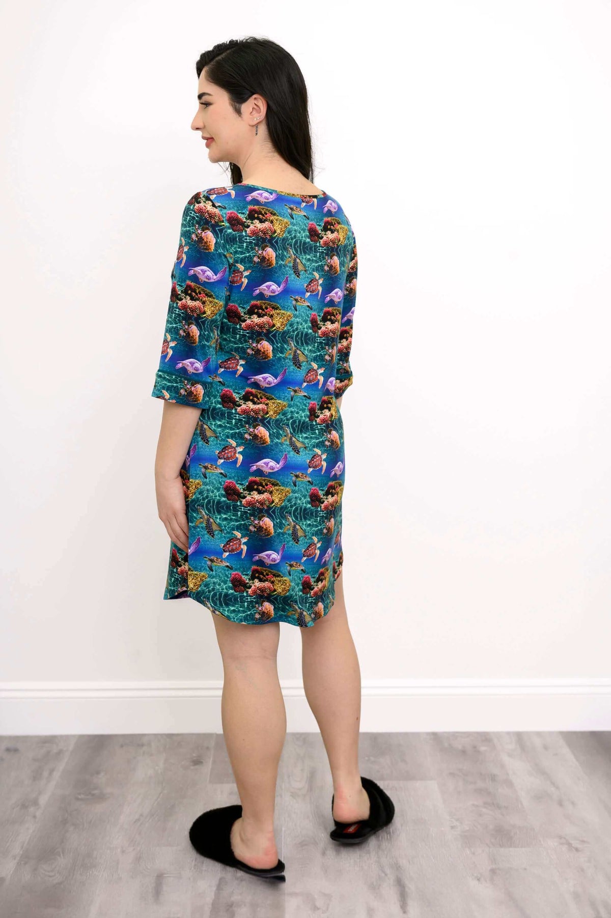 Back view of a woman in coral reef print bamboo sleepshirt showing relaxed fit