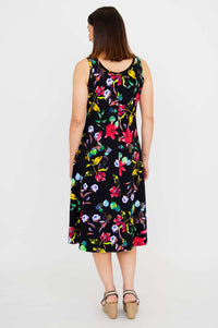 Back view of woman in black floral tank dress showing fit and length