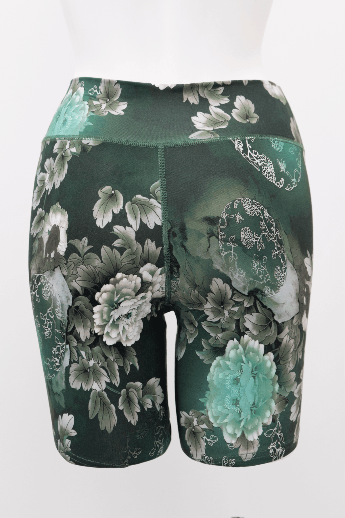 Back view of Hallie Bamboo Shorts in green featuring seamless construction and floral details