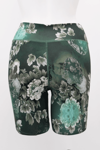Back view of Hallie Bamboo Shorts in green featuring seamless construction and floral details