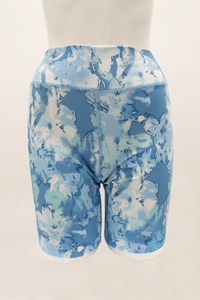 Back view of Hallie Bamboo Shorts in a watercolor blue floral print on a mannequin