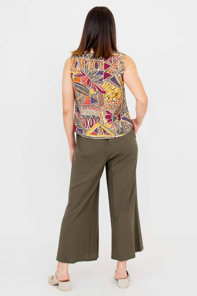 Back view of a woman wearing the Havana bamboo linen tank and olive pants