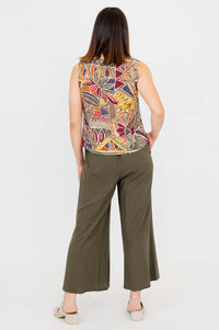 Back view of a woman wearing the Havana bamboo linen tank and olive pants
