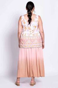 Back view of model wearing Kaya Floral Tiered Tank Top featuring criss cross straps