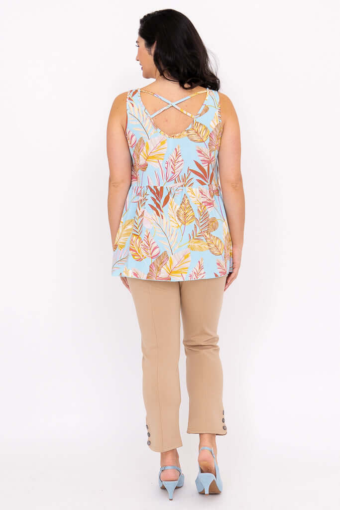 Back view of woman showing criss-cross detail on tropical tank top