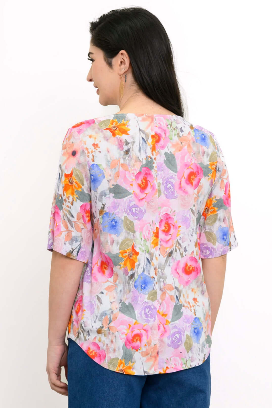 Back view of Liza floral bamboo linen blouse showing shirt tail hemline