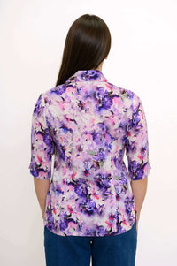 Back view of purple floral blouse showing collar and princess seams