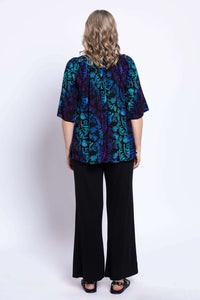 Back view of model in Luna Boho Peasant Top showing floral print
