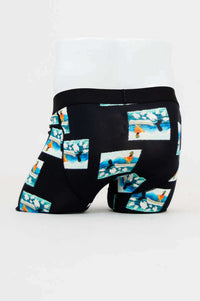 Back view of Middle Man Underwear featuring colorful ocean print and black bamboo fabric