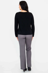 Back view of woman wearing black Mona boat neck French Terry top and grey pants