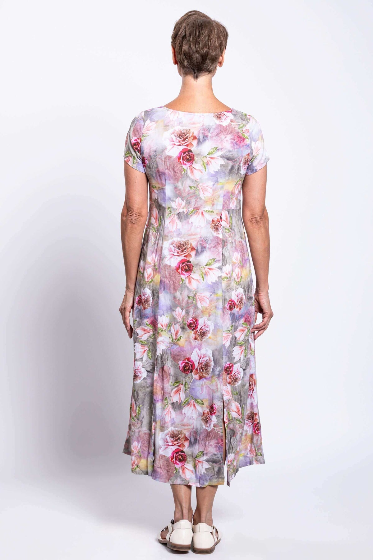 Back view of woman in a floral panel dress showing the back fit and length