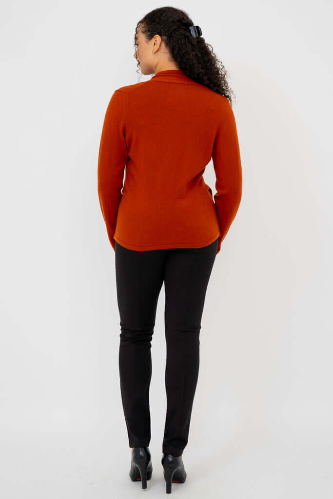 Back view of rust-colored cashmere surplice sweater