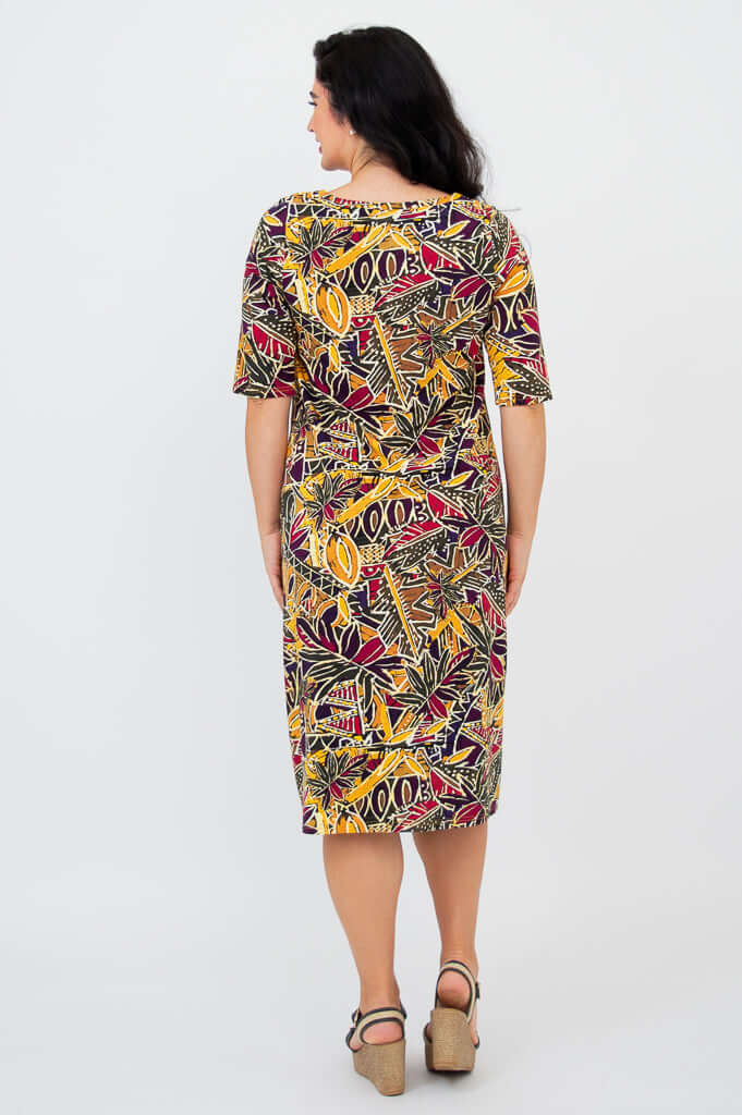 Back view of Olivia dress in Tropikal print worn by woman