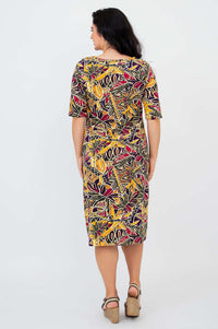 Back view of Olivia dress in Tropikal print worn by woman
