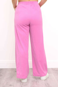 Back view of wide-leg pink corduroy pants with elastic waistband