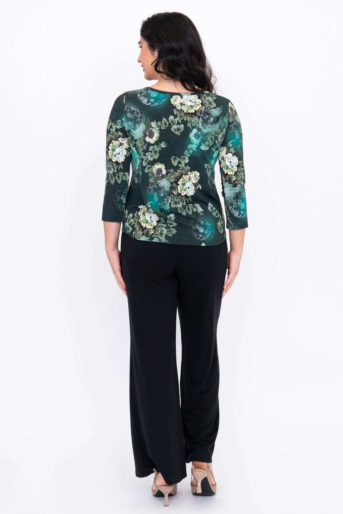 Back view of model wearing a dark green floral sweetheart neckline top with 3/4 sleeves