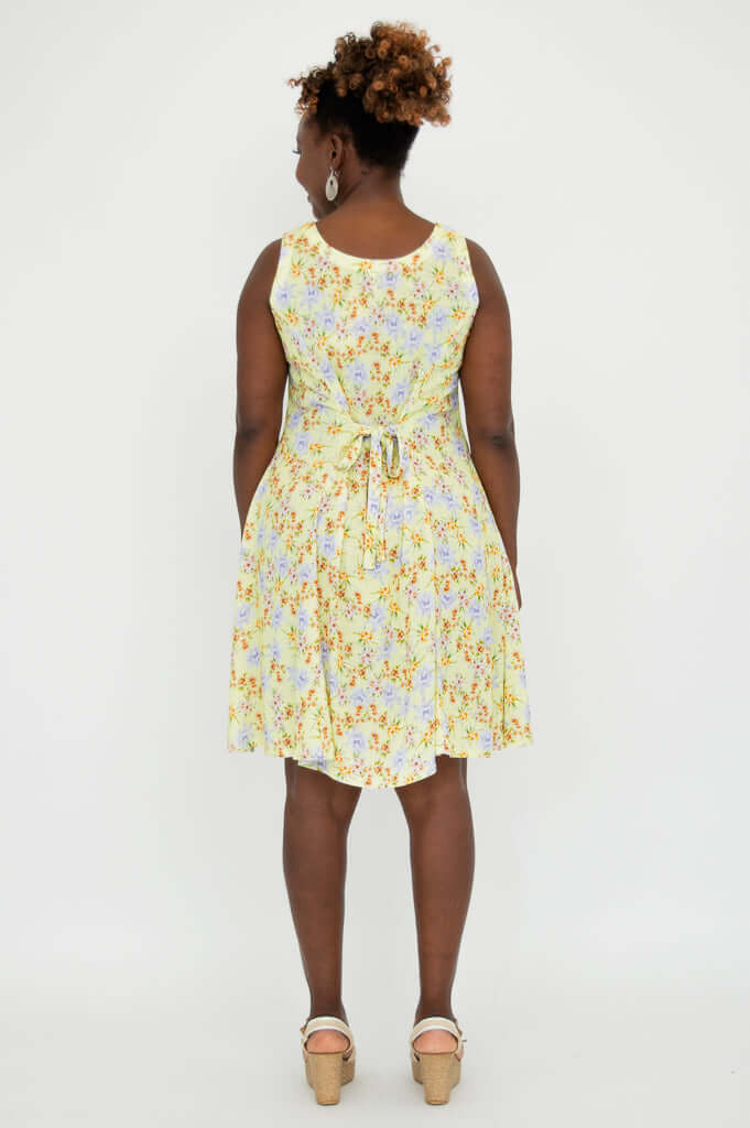 Back view of yellow floral dress with tie-belt at the waist