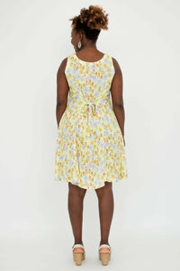 Back view of yellow floral dress with tie-belt at the waist