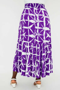 Model wearing purple and white patterned ankle-length skirt, back view