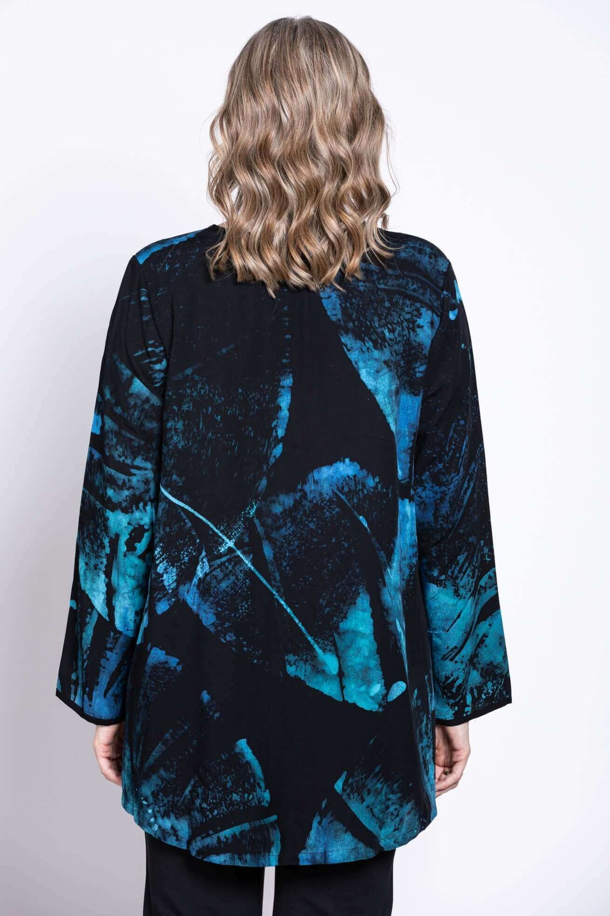 Back view of the blue and black batik print blouse showing the pattern and fit