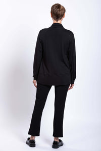Back view of woman wearing a black French Terry jacket and black pants