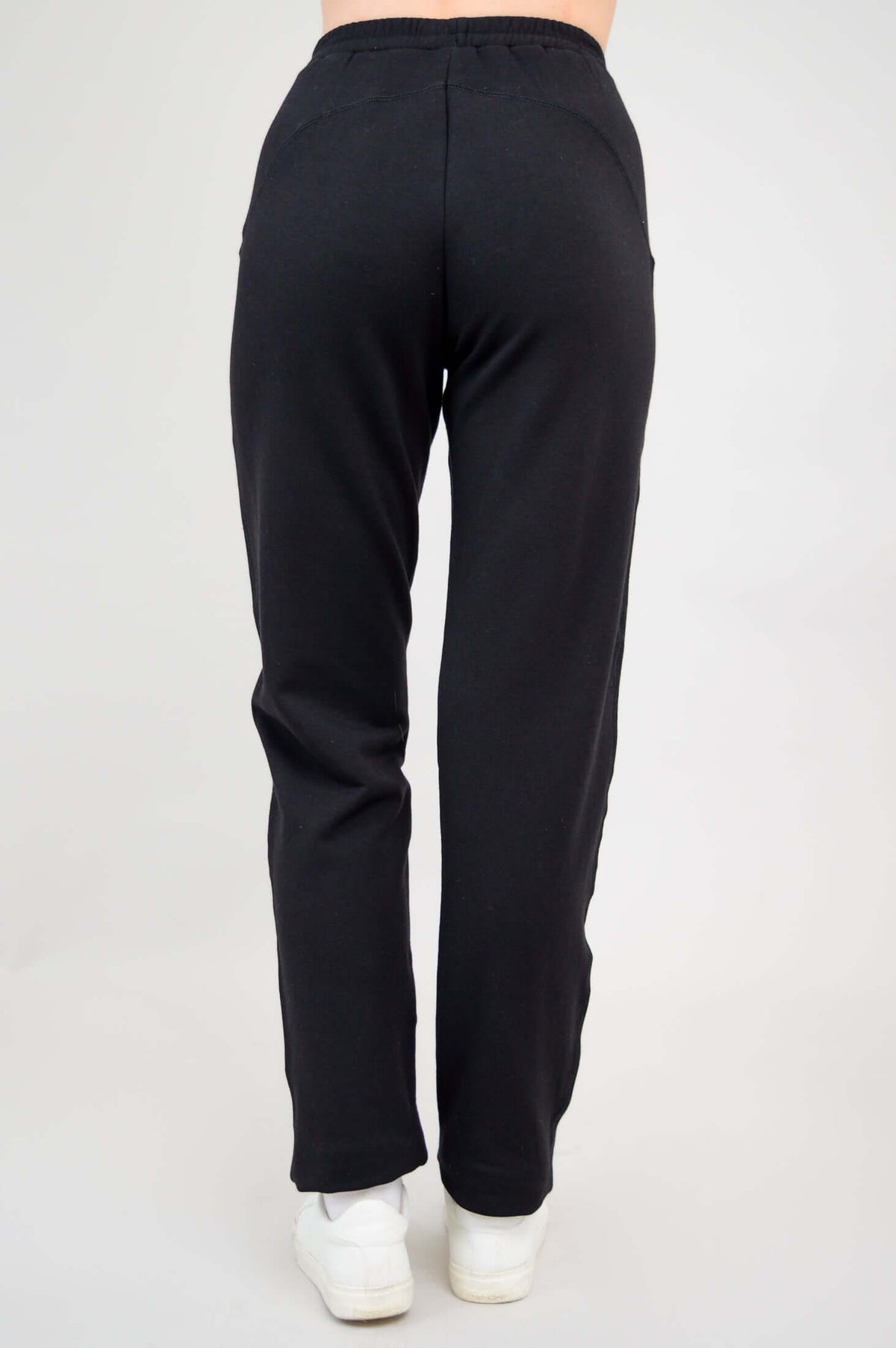 Back view of black bamboo fleece track pants highlighting straight leg and waistband