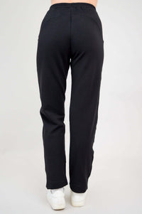 Back view of black bamboo fleece track pants highlighting straight leg and waistband