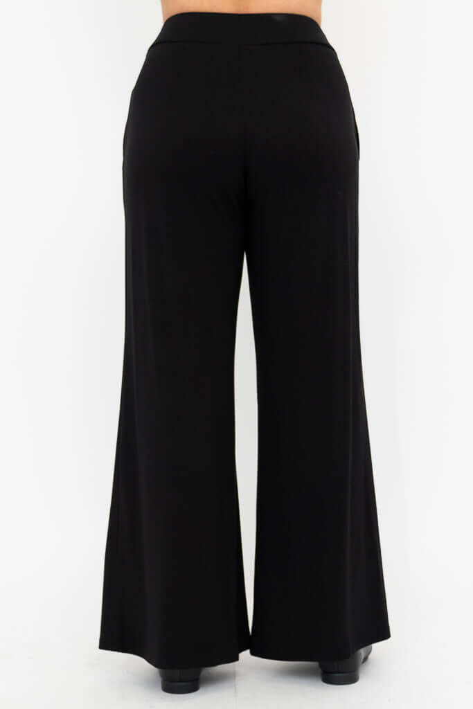 Back view of model wearing black wide leg pants