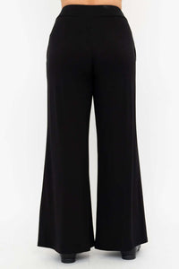 Back view of model wearing black wide leg pants