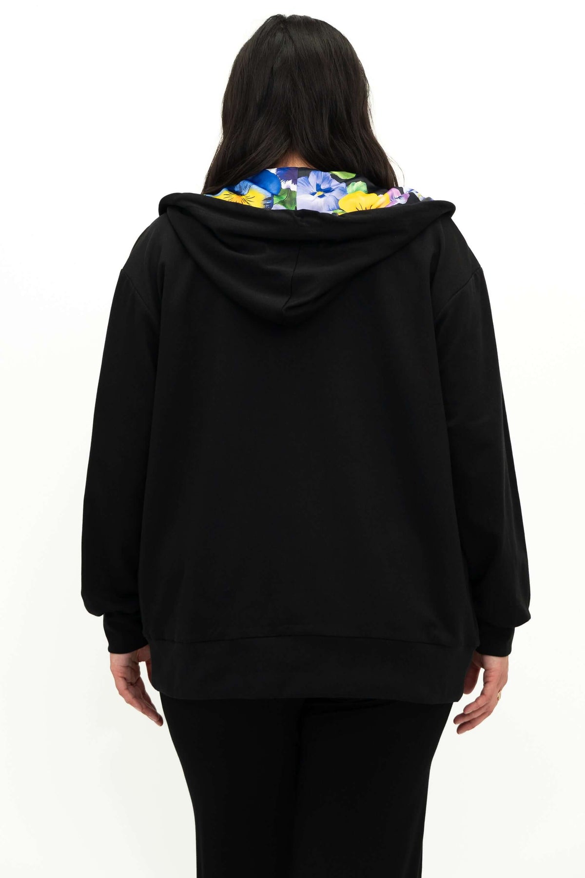 Back view of woman in black zip hoody showing collar with floral lining