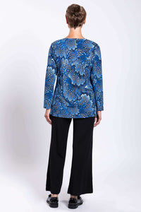 Back view of woman wearing blue botanical print long sleeve top