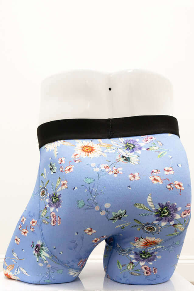Back view of blue floral men's boxer briefs highlighting waistband and design