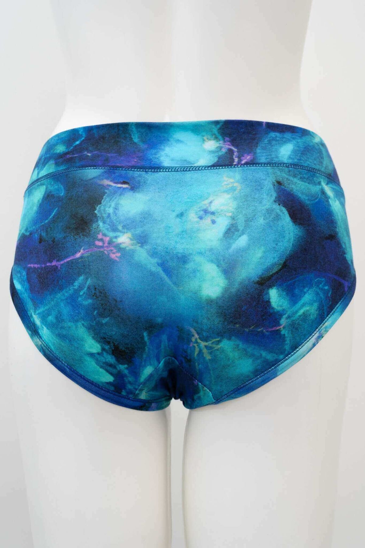 Back view of blue watercolour bamboo hipster underwear on mannequin