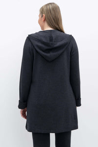 Back view of a woman wearing a dark grey hooded jacket