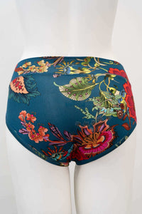 Back view of hipster underwear with colorful floral design on teal fabric