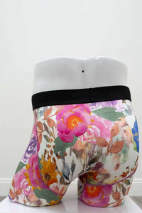 Back view of floral men's boxer briefs with black waistband and colorful design