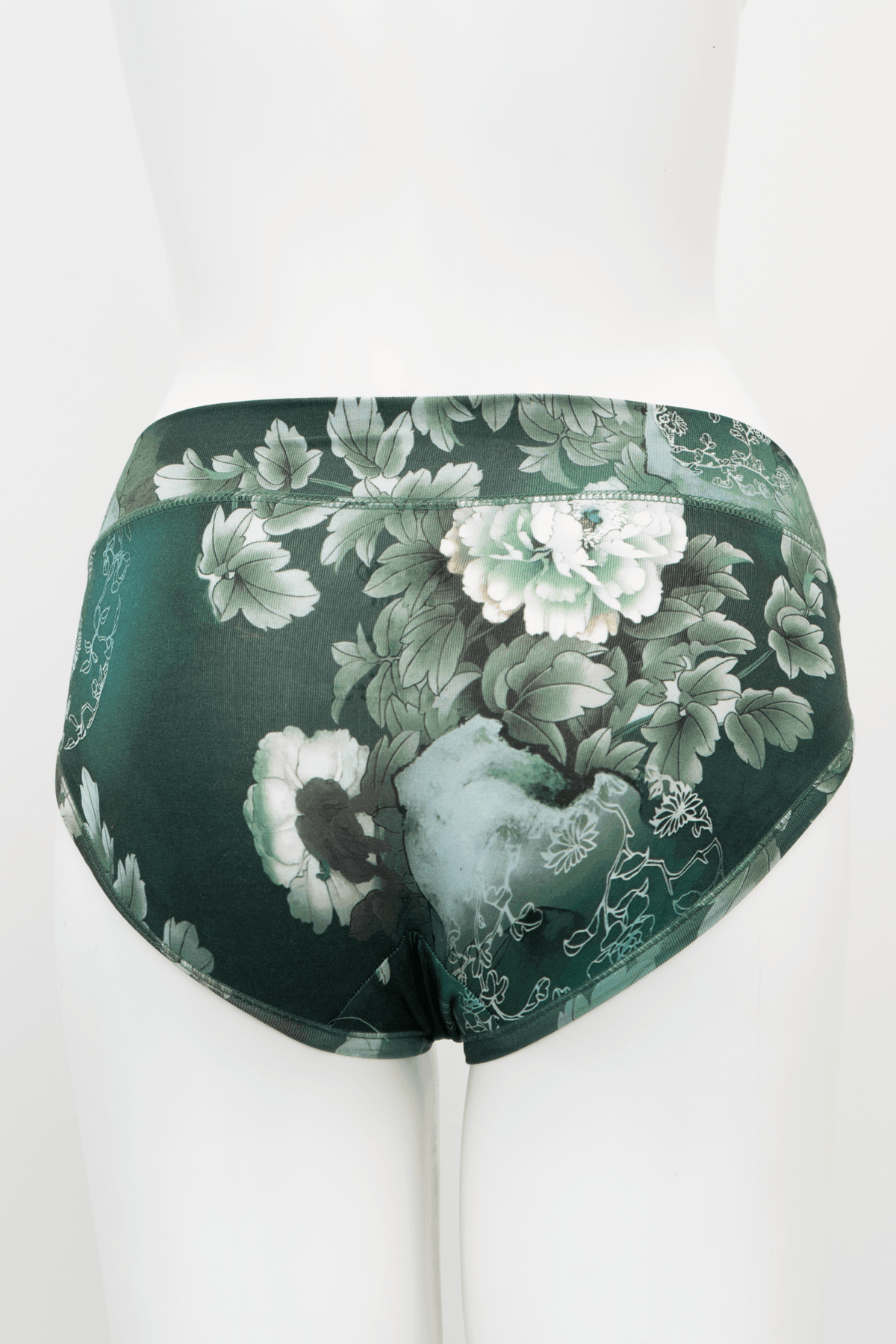 Back view of green hipster underwear featuring a detailed white floral print on mannequin