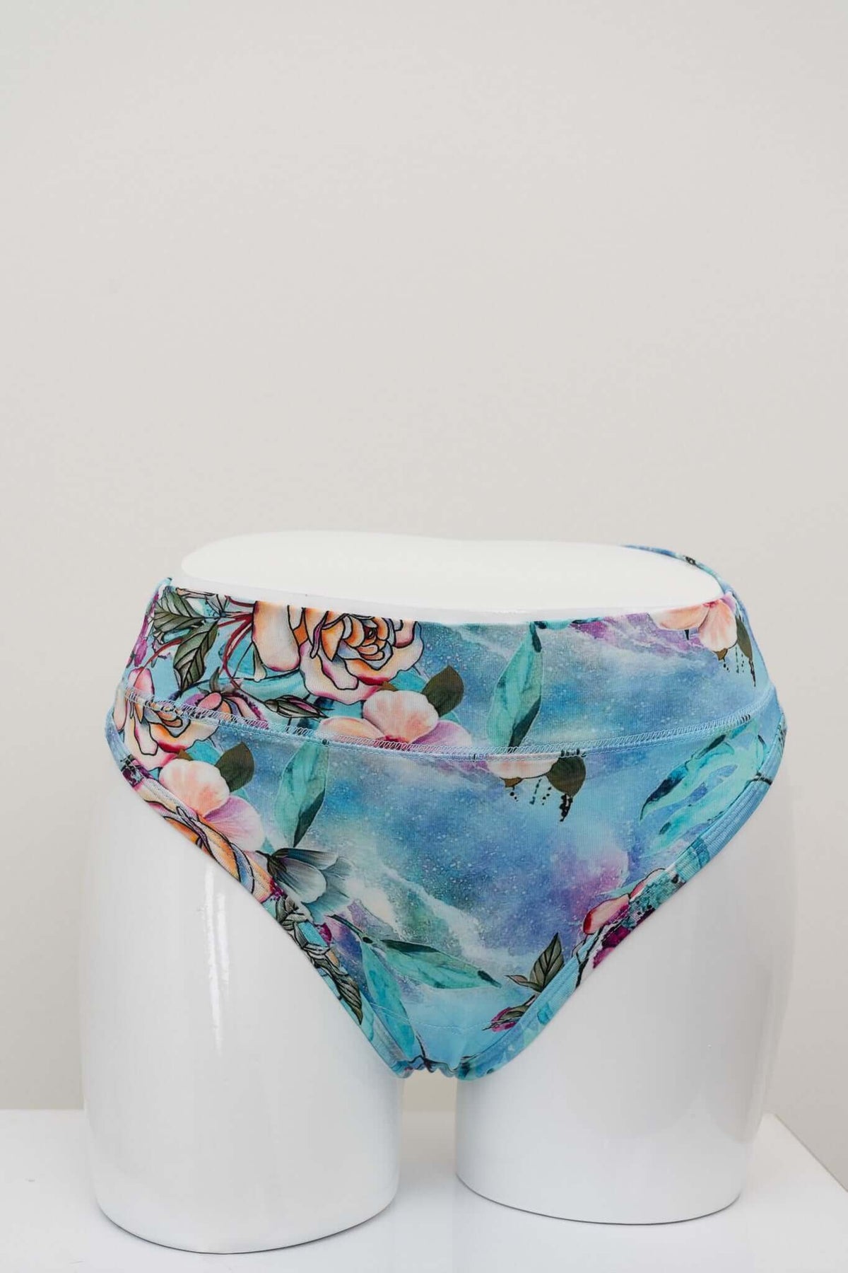 Back view of high-rise thong underwear with blue floral bamboo fabric