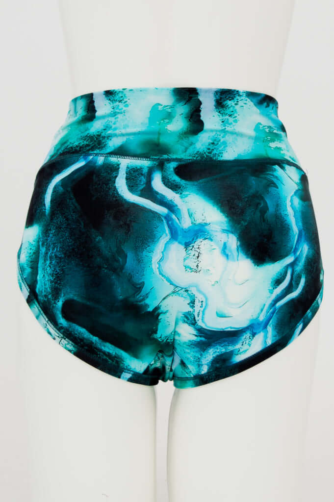 Back view of high-waisted brief with aqua marble pattern on mannequin