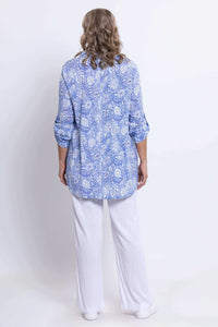 Back view of woman wearing light blue floral bamboo-linen tunic